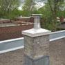 Chimney with a metallic crown cover