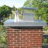 Chimney with a metallic crown cover